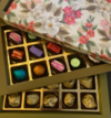 attachment-https://taubys.com/wp-content/uploads/2022/10/Green-Floral-box-15-Assorted-chocolates-Rs-325-100x107.png